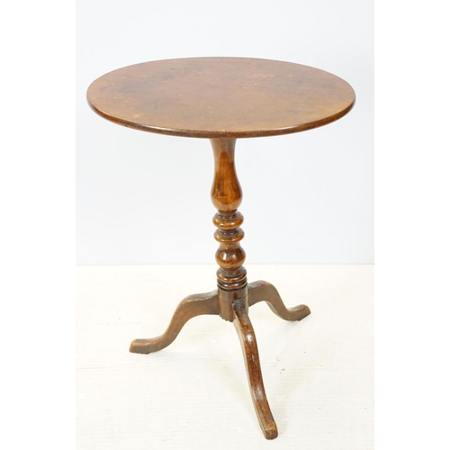 658 - Mahogany oval occasional table on turned support and tripod base, 67cm high x 53cm wide x 39cm deep