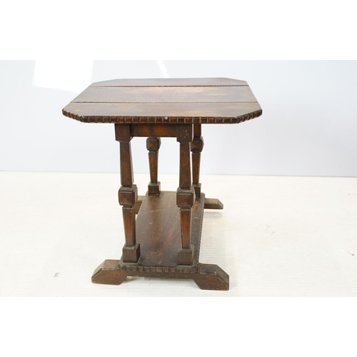 662 - Early 20th century oak drop leaf swivel top table, with dentil carved edging, 45cm high x 46cm wide ... 