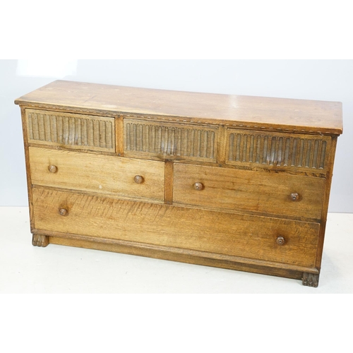 663 - Nigel Griffiths (The Old Cheese Factory Grangemill Derbyshire) carved oak chest with an arrangement ... 