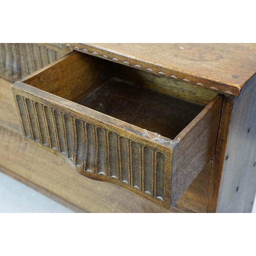 663 - Nigel Griffiths (The Old Cheese Factory Grangemill Derbyshire) carved oak chest with an arrangement ... 