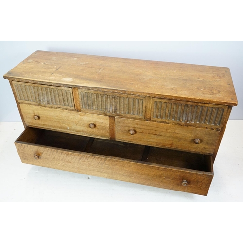 663 - Nigel Griffiths (The Old Cheese Factory Grangemill Derbyshire) carved oak chest with an arrangement ... 