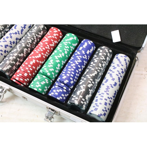 183 - Cased poker gaming set filled with coloured counters and sets of cards.