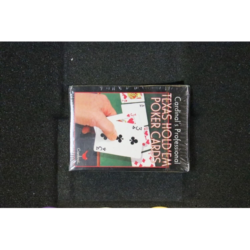 183 - Cased poker gaming set filled with coloured counters and sets of cards.