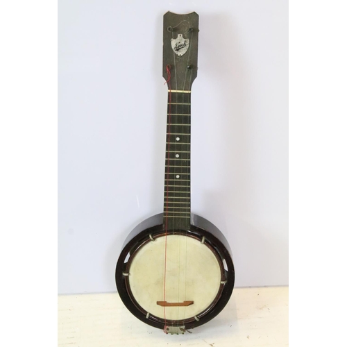 184 - Keech banjilele banjo with animal hide drum with fitted case. Measures 55cm.