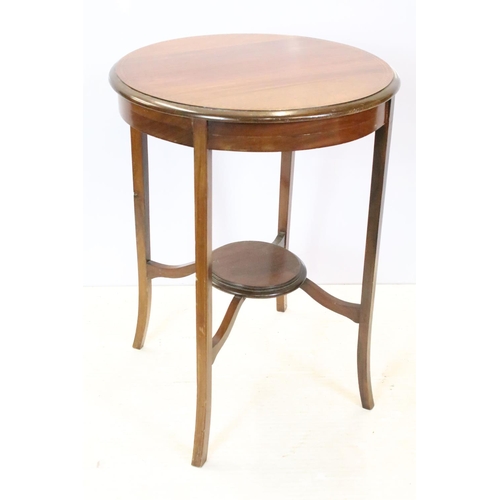 642 - Early 20th century circular mahogany inlaid occasional table, with tier below on splayed legs, 70.5c... 