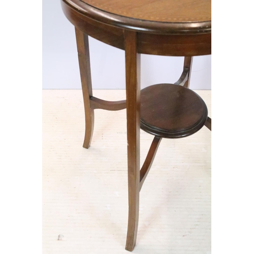 642 - Early 20th century circular mahogany inlaid occasional table, with tier below on splayed legs, 70.5c... 