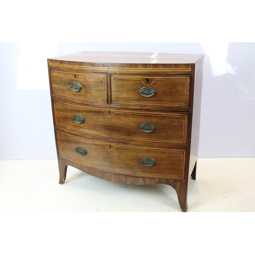 651 - Edwardian mahogany bow front inlaid chest of two short and two long drawers on splayed legs, 87cm hi... 