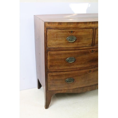 651 - Edwardian mahogany bow front inlaid chest of two short and two long drawers on splayed legs, 87cm hi... 