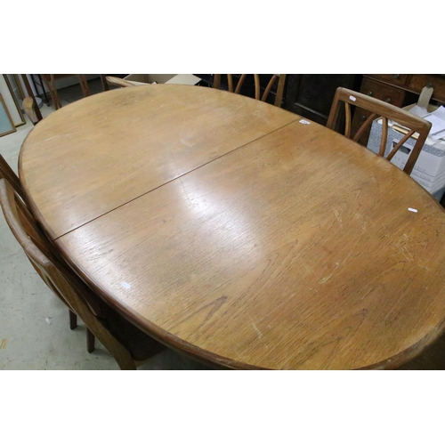 652 - G Plan oval extendable dining table, 72cm high x 162cm long (unextended) x 106cm wide and six chairs... 