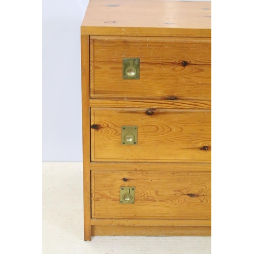 655 - Pine chest of three drawers with brass recessed handles, 58.5cm high x 53cm wide x 41cm deep