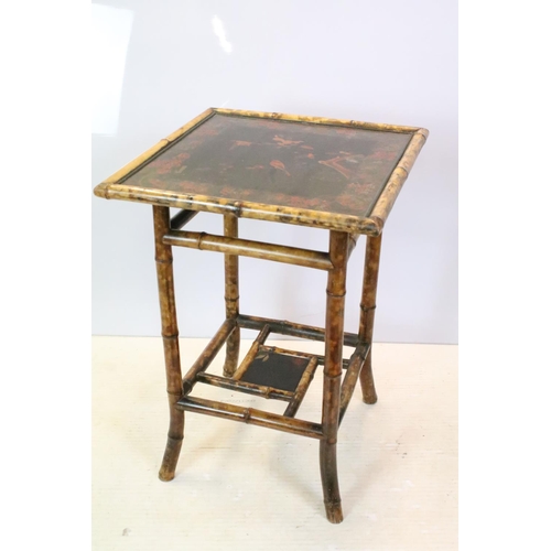 660 - Oriental bamboo work table, the black lacquered top decorated with bird and branches, with lacquer p... 