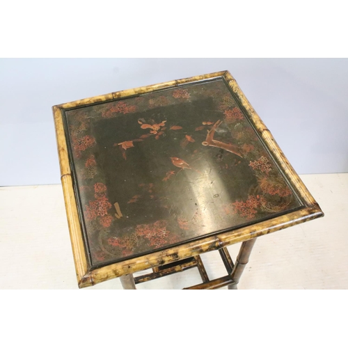 660 - Oriental bamboo work table, the black lacquered top decorated with bird and branches, with lacquer p... 