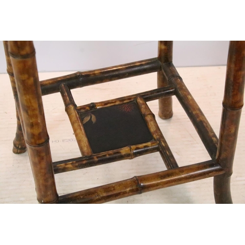 660 - Oriental bamboo work table, the black lacquered top decorated with bird and branches, with lacquer p... 