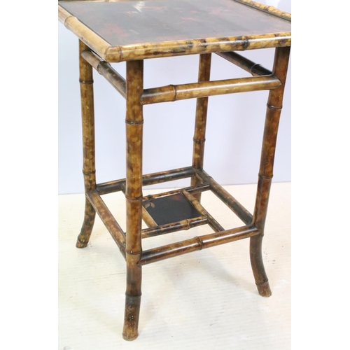 660 - Oriental bamboo work table, the black lacquered top decorated with bird and branches, with lacquer p... 