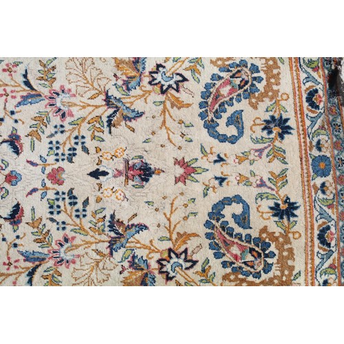 690 - Middle Eastern carpet rug having a white ground with blue florals to central panel and border. Measu... 