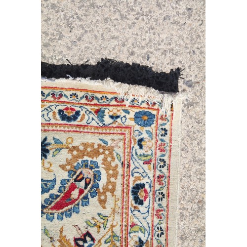 690 - Middle Eastern carpet rug having a white ground with blue florals to central panel and border. Measu... 