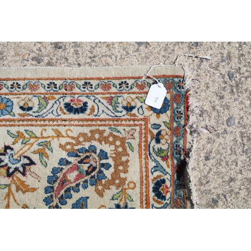 690 - Middle Eastern carpet rug having a white ground with blue florals to central panel and border. Measu... 