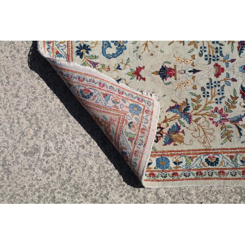 690 - Middle Eastern carpet rug having a white ground with blue florals to central panel and border. Measu... 