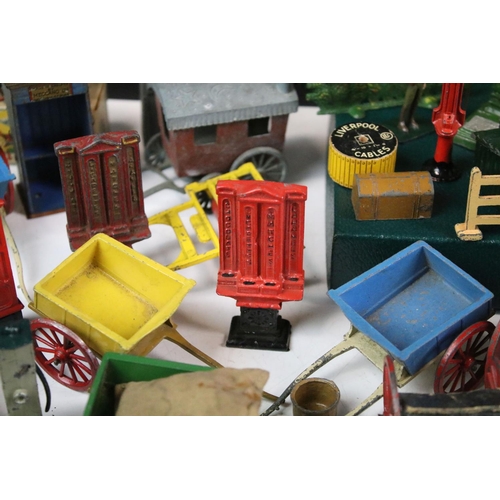 1328 - Large quantity of mainly Britains and some Dinky accessories to include horse carts, push carts, mil... 