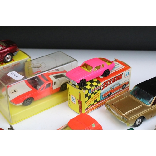 1332 - Three boxed diecast models to include boxed Dinky 176 NSU Ro 80 in burgundy, cased Dinky 187 De Toma... 