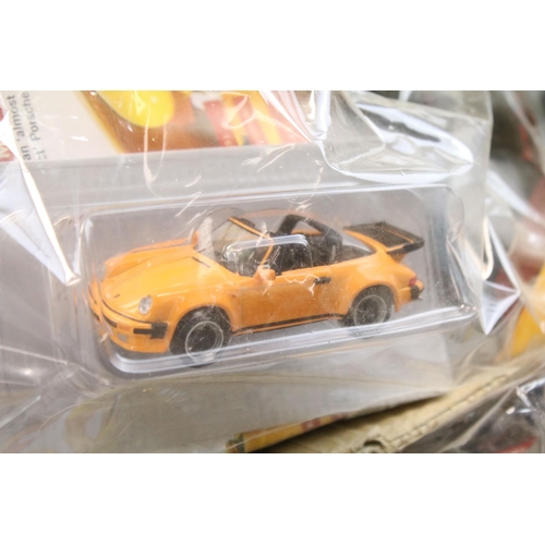 1284 - 34 carded diecast models to include A Century Of Cars and DeAgostini, all in bags with carded backin... 