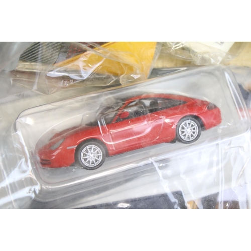 1284 - 34 carded diecast models to include A Century Of Cars and DeAgostini, all in bags with carded backin... 