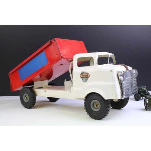 1314 - Triang tin plate truck with white cab and red tipper with decals, together with 4 x military diecast... 