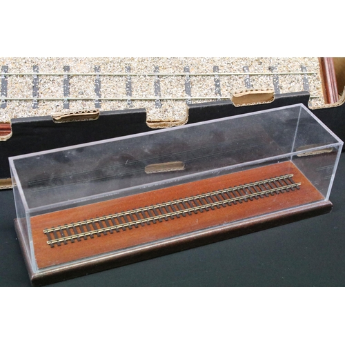 223 - Five locomotive display cases with wooden plinth and glass casing, 2 x O gauge and 3 x OO gauge, plu... 