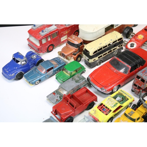 1286 - Around 30 play worn diecast models from the 1960s onwards to include Triang Spot On, Corgi, Lonestar... 