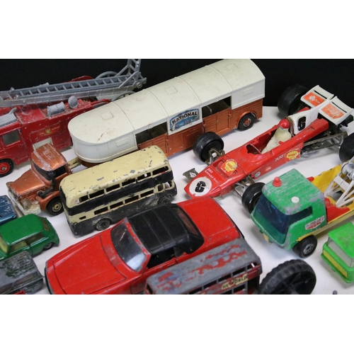 1286 - Around 30 play worn diecast models from the 1960s onwards to include Triang Spot On, Corgi, Lonestar... 