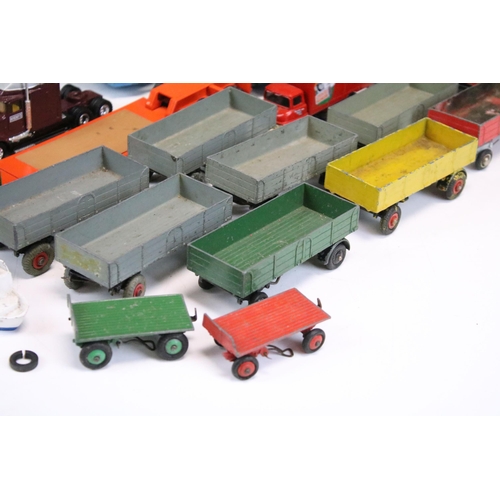 1303 - 24 Play worn commercial diecast models, mainly from the mid 20th C to include Dinky Car Transporter,... 