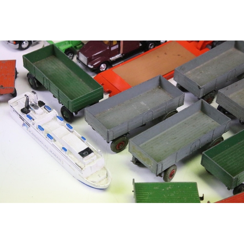 1303 - 24 Play worn commercial diecast models, mainly from the mid 20th C to include Dinky Car Transporter,... 