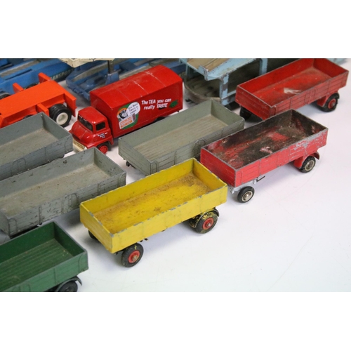 1303 - 24 Play worn commercial diecast models, mainly from the mid 20th C to include Dinky Car Transporter,... 