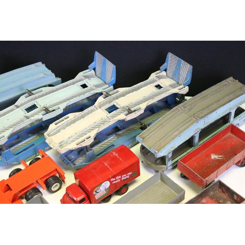 1303 - 24 Play worn commercial diecast models, mainly from the mid 20th C to include Dinky Car Transporter,... 