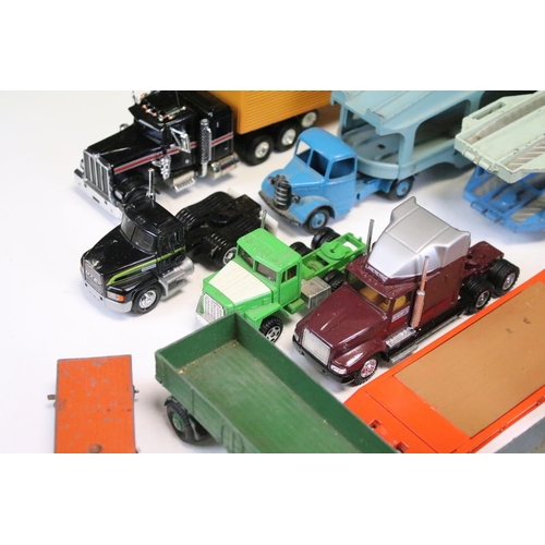 1303 - 24 Play worn commercial diecast models, mainly from the mid 20th C to include Dinky Car Transporter,... 