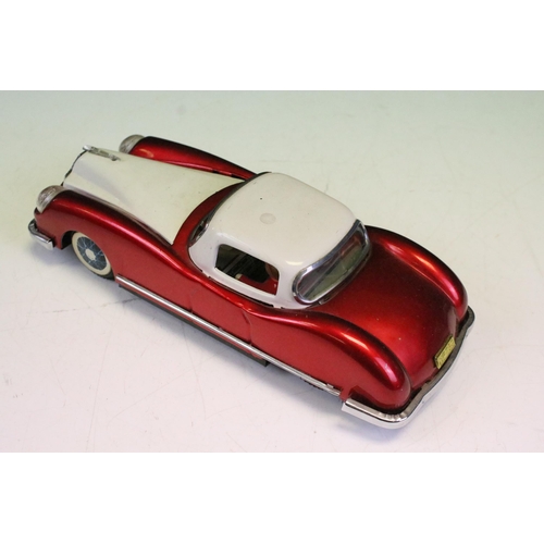 1304 - Six 1/18 - 1/24 scale tin plate metal models including a friction drive red/white car with driver (m... 