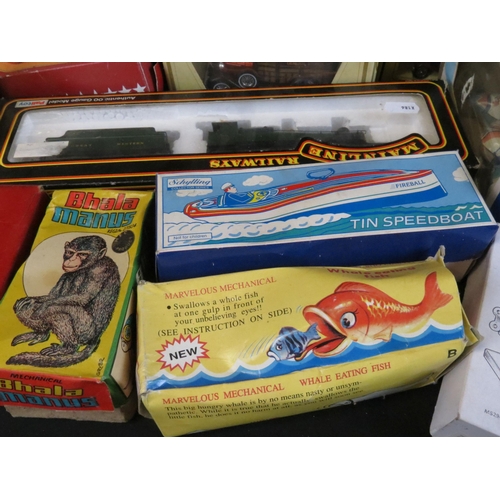 379 - Collection of various boxed toys to include model rail, tin plate and diecast models featuring Palit... 