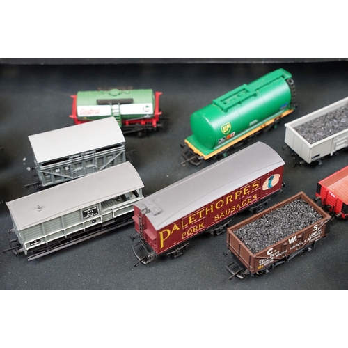 109 - 100 OO gauge items of rolling stock featuring wagons, vans and tankers to include Hornby, Bachmann, ... 