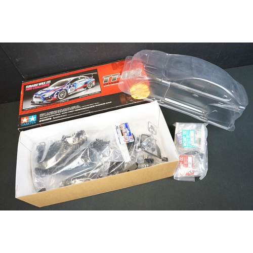 295 - Three boxed Tamiya plastic model kits to include 1/10 scale Subaru WRX STI NBR Challenge TT-02 Chass... 