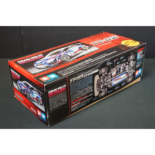 295 - Three boxed Tamiya plastic model kits to include 1/10 scale Subaru WRX STI NBR Challenge TT-02 Chass... 