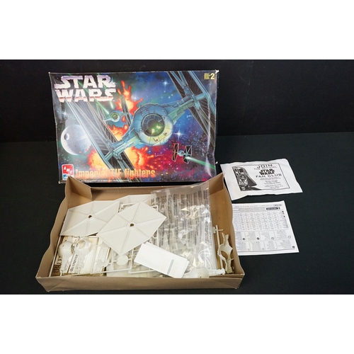 308 - Four boxed AMT / ERTL plastic model kits featuring Star Wars Cantina Action Scene, Star Wars Death S... 