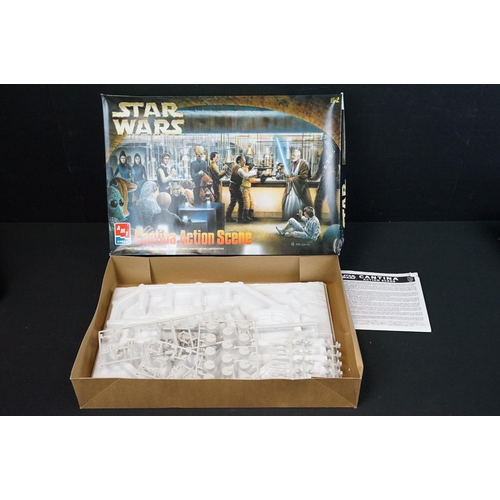 308 - Four boxed AMT / ERTL plastic model kits featuring Star Wars Cantina Action Scene, Star Wars Death S... 