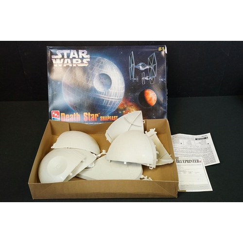 308 - Four boxed AMT / ERTL plastic model kits featuring Star Wars Cantina Action Scene, Star Wars Death S... 