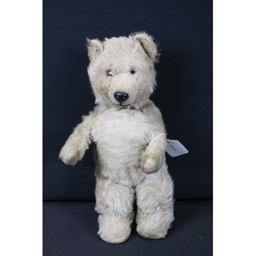 428 - Seven Mid 20th C onwards teddy bears featuring a musical bear, bears showing age related wear, fur p... 