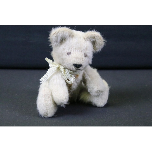 428 - Seven Mid 20th C onwards teddy bears featuring a musical bear, bears showing age related wear, fur p... 