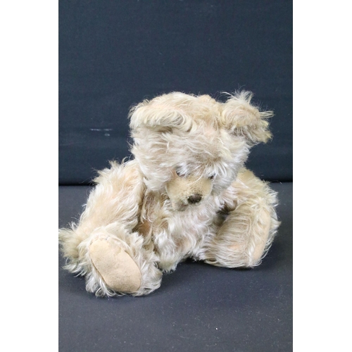 428 - Seven Mid 20th C onwards teddy bears featuring a musical bear, bears showing age related wear, fur p... 