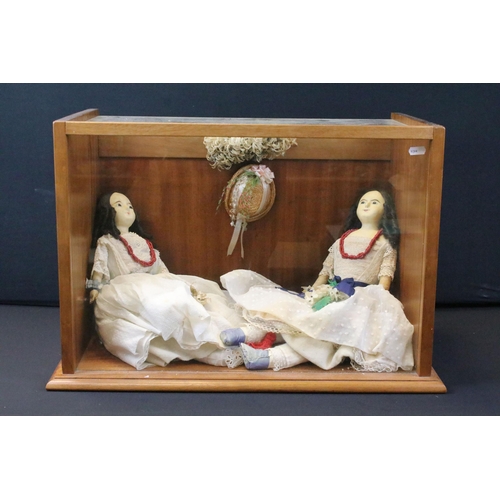 445 - Two early 20th C wax headed dolls in the form of twins, contained within wooden and glass display ca... 