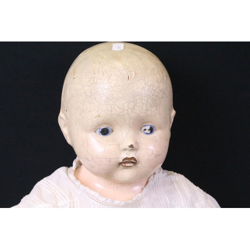 455 - Early 1920s Effanbee Doll with soft body, original dress and blue shoes, heavy wear and cracking to ... 