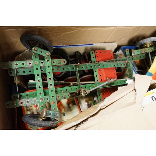 387 - Very large collection of Meccano items and accessories featuring various colour parts, wheels, instr... 