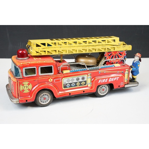 415 - Two fire engine models to include boxed tin plate ME 699 Battery Operated Fire Chief and tin plate f... 